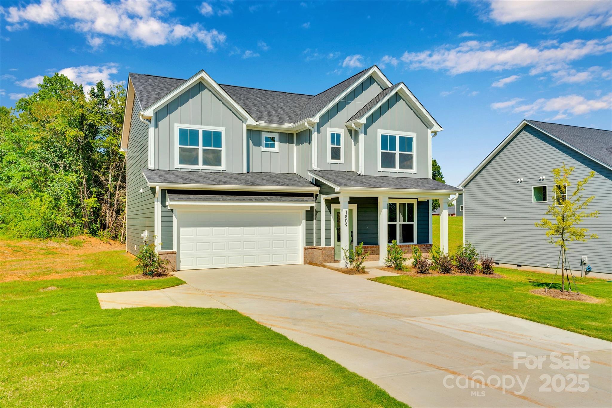 1809 Country Club Road, Unit 3 Lincolnton, NC 28092 - Photo 2 of 43 a front view of a house with a yard