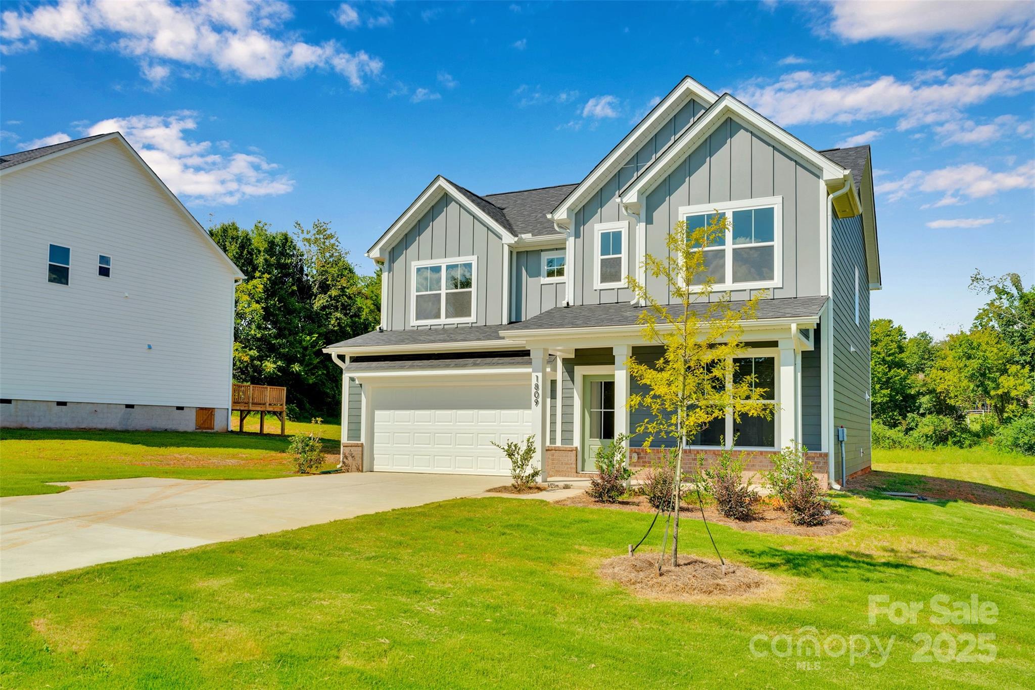 1809 Country Club Road, Unit 3 Lincolnton, NC 28092 - Photo 3 of 43 a front view of a house with yard and green space