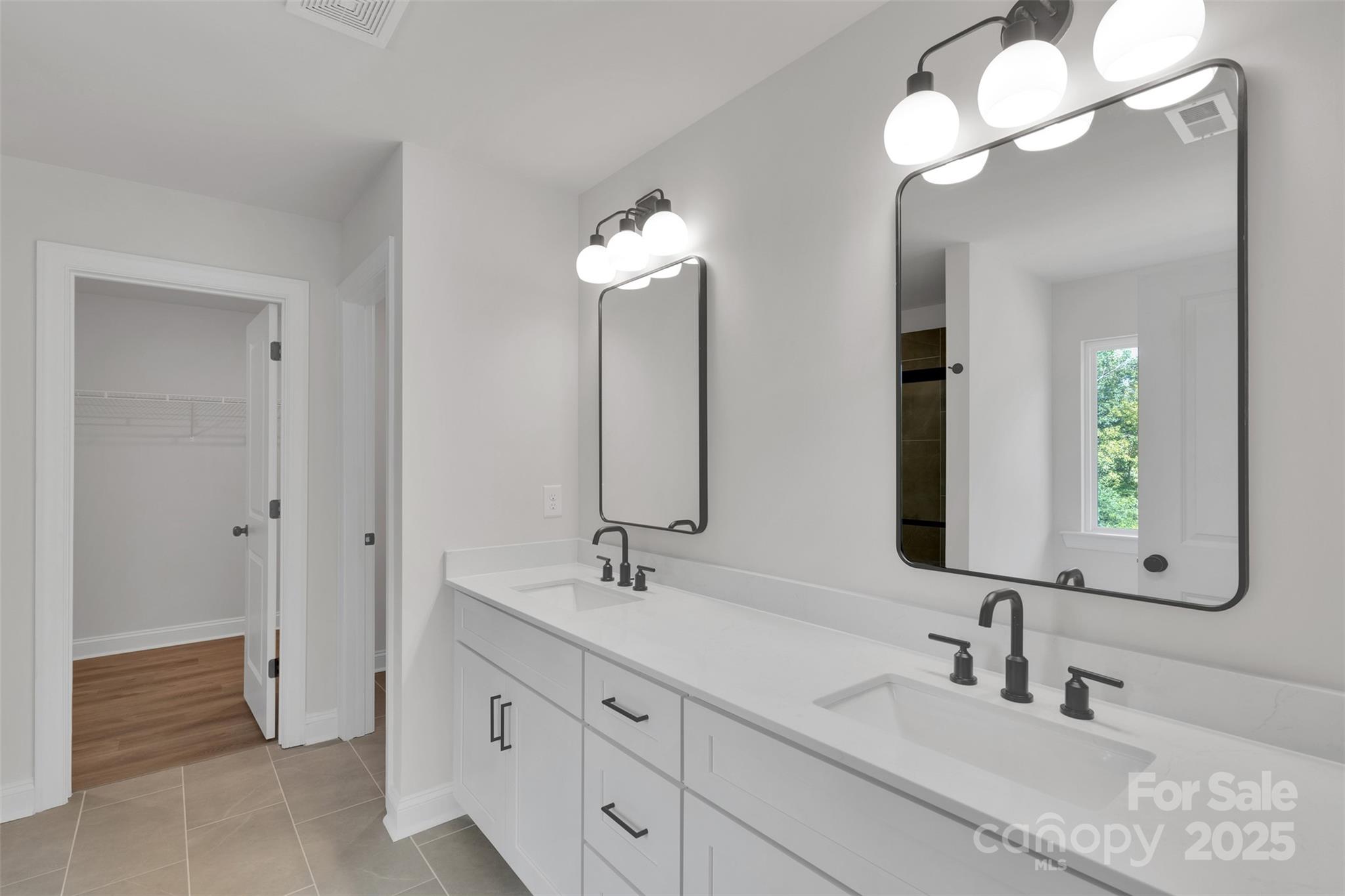 1809 Country Club Road, Unit 3 Lincolnton, NC 28092 - Photo 31 of 43 a bathroom with double vanity sinks and a mirror