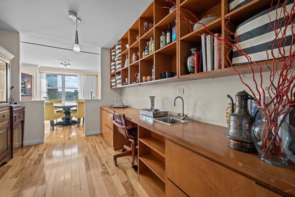 2500 Johnson Avenue, Unit 2NP Bronx, NY 10463 - Photo 13 of 45 a kitchen with stainless steel appliances granite countertop a stove and a wooden floors