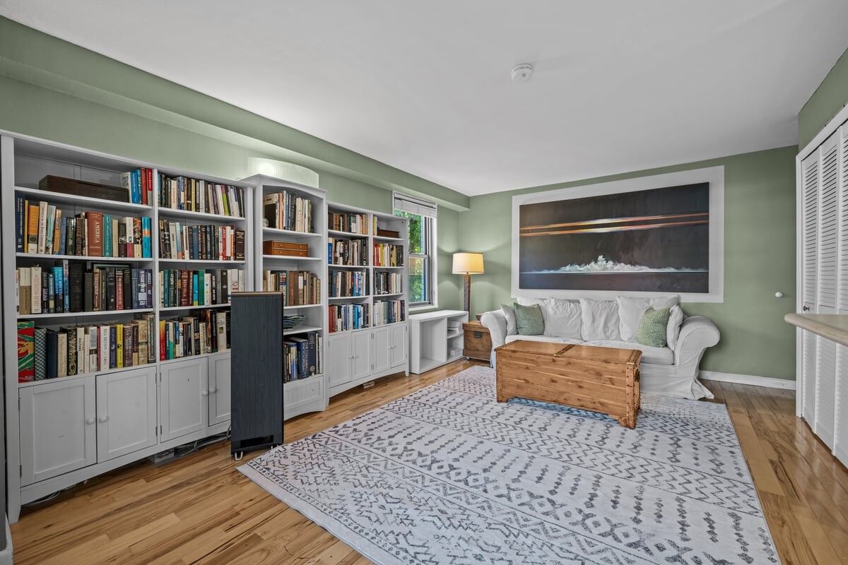 2500 Johnson Avenue, Unit 2NP Bronx, NY 10463 - Photo 16 of 45 a bedroom with furniture and a book shelf