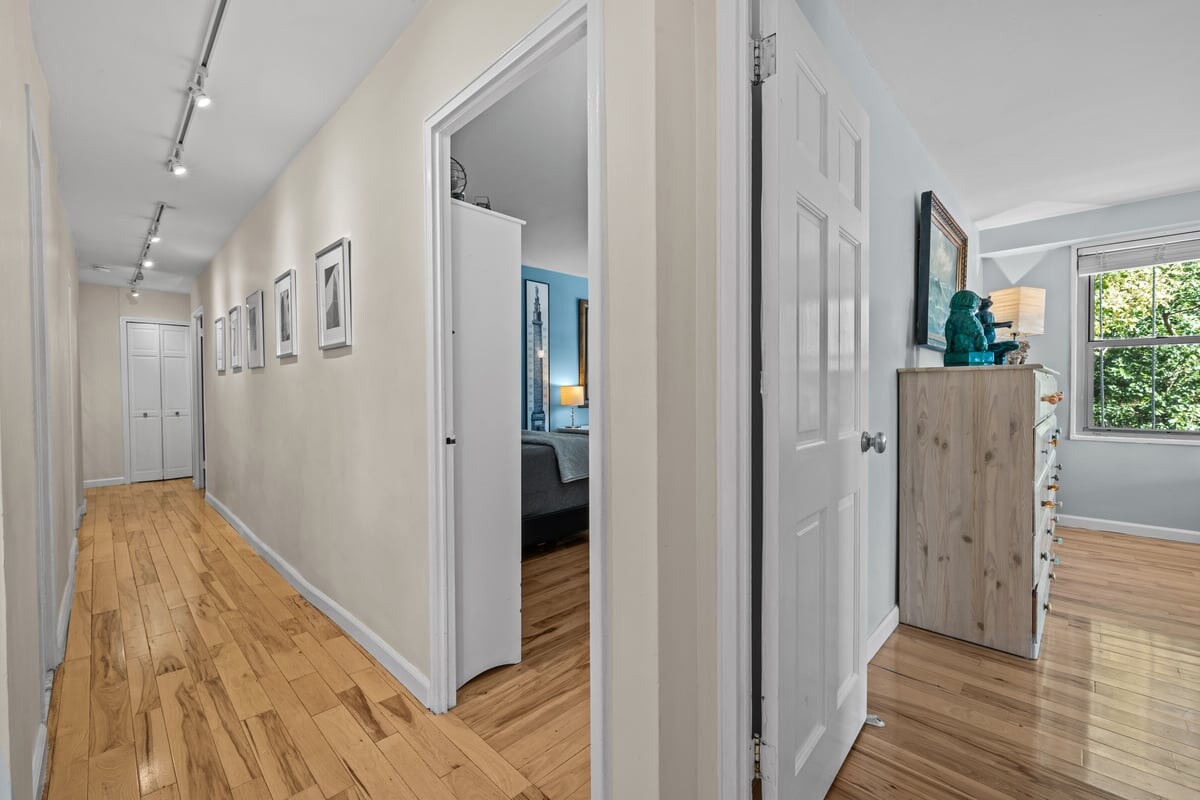 2500 Johnson Avenue, Unit 2NP Bronx, NY 10463 - Photo 17 of 45 a view of a hallway with wooden floor and a bathroom