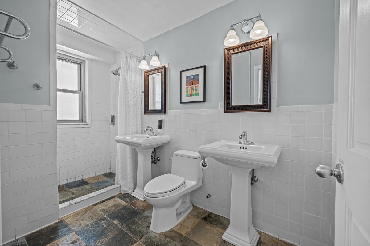2500 Johnson Avenue, Unit 2NP Bronx, NY 10463 - Photo 20 of 45 a bathroom with a toilet sink and mirror