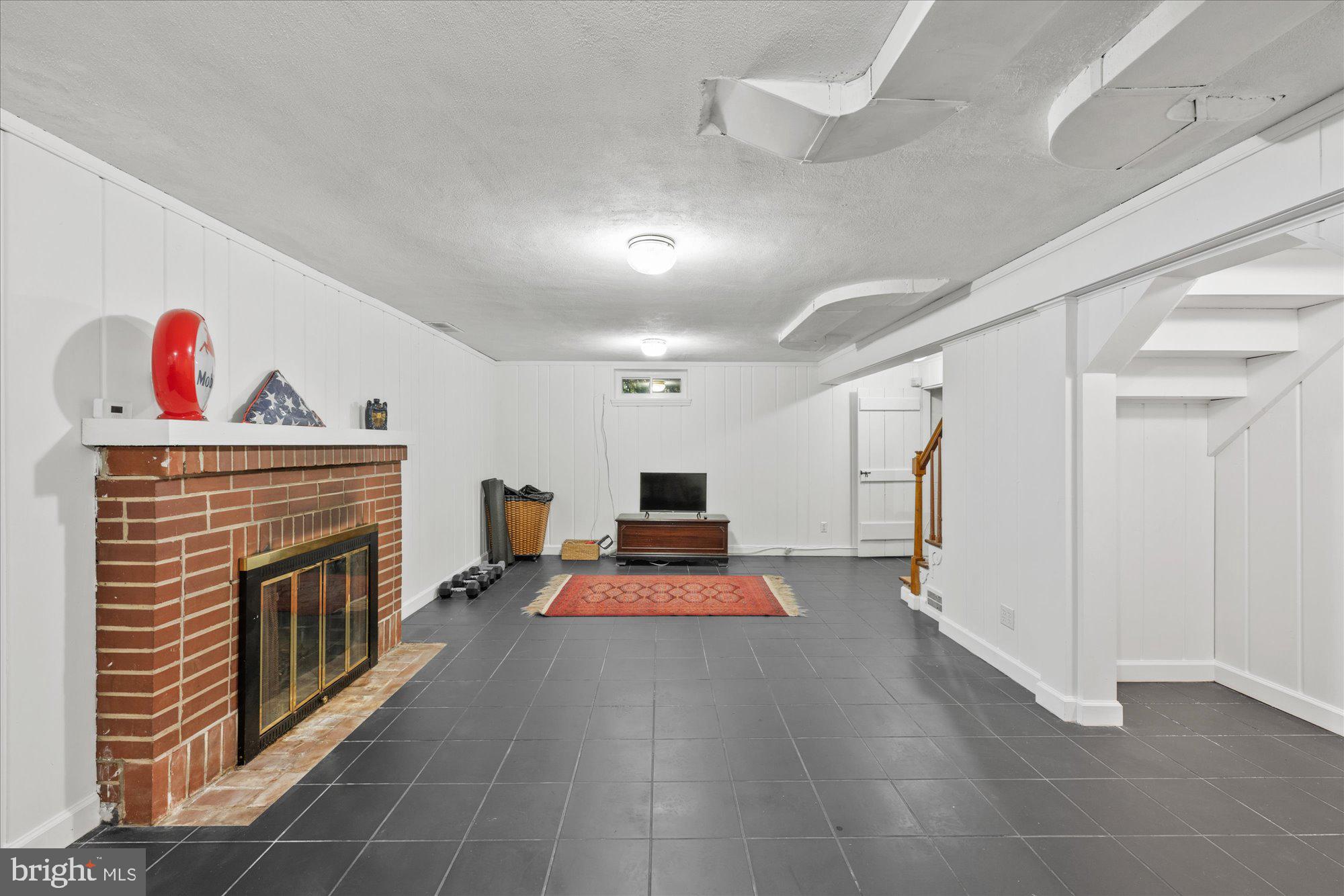 3609 Appleton Street Northwest Washington, DC 20008 - Photo 27 of 34 Lower level spacious rec room with fireplace