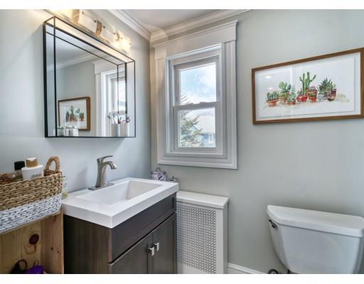 8 Enmore Road Melrose, MA 02176 - Photo 16 of 27 a bathroom with a granite countertop sink mirror and vanity