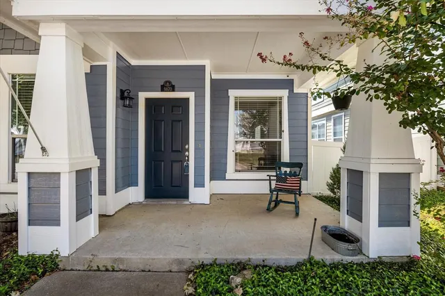 front view of a house with a bench