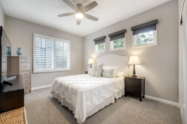 a bedroom with a bed furniture and a window