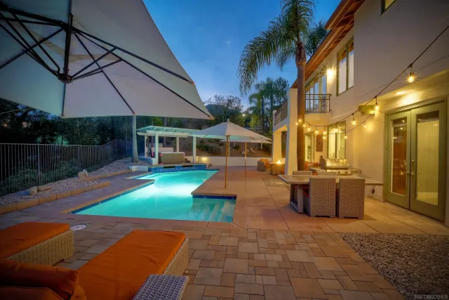 a view of a patio with couches and potted plants