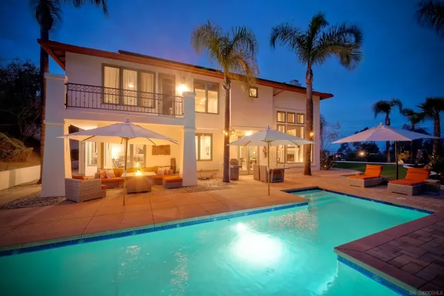 a view of an house with backyard outdoor seating area and furniture