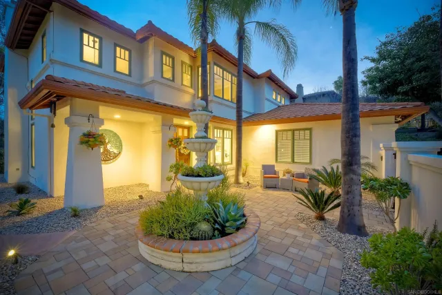 a view of a house with a porch and furniture