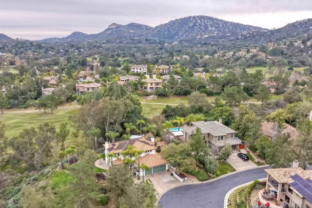 an aerial view of a house with a lake view
