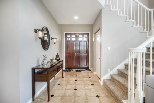 a view of entryway with wooden floor