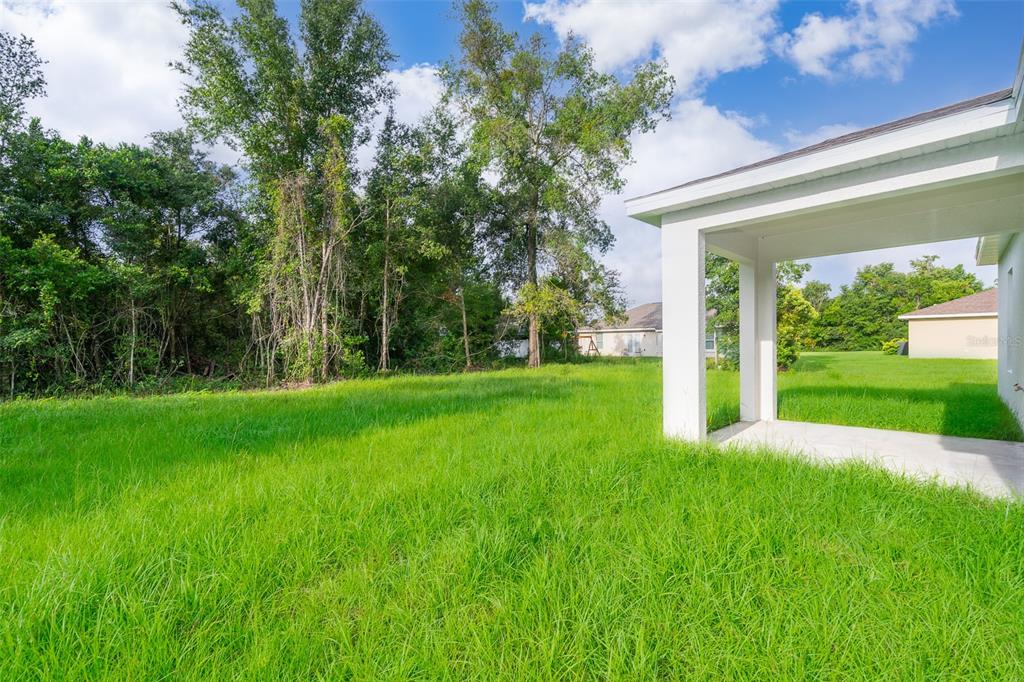 13805 Southwest 43rd Circle Ocala, FL 34473 - Photo 21 of 21 a view of a house with a big yard