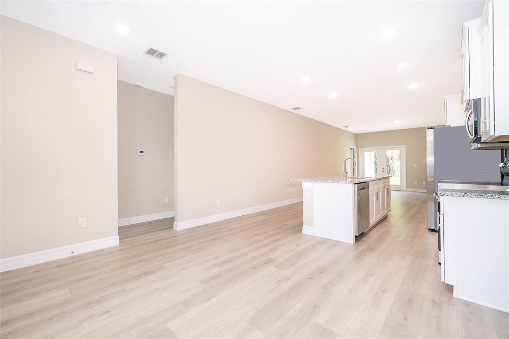 13805 Southwest 43rd Circle Ocala, FL 34473 - Photo 4 of 21 a view of empty room with wooden floor