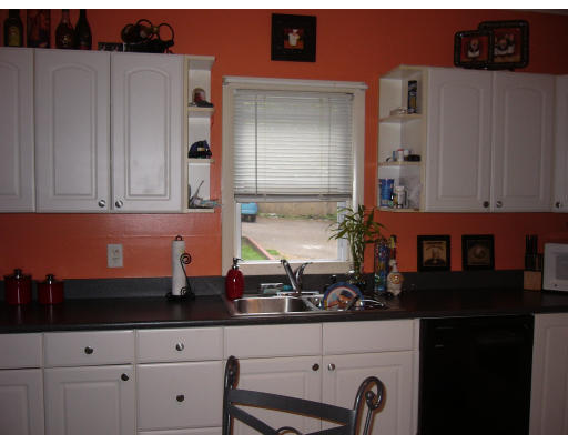 561 Division Street Fall River, MA 02721 - Photo 2 of 5 a kitchen with a sink and cabinets