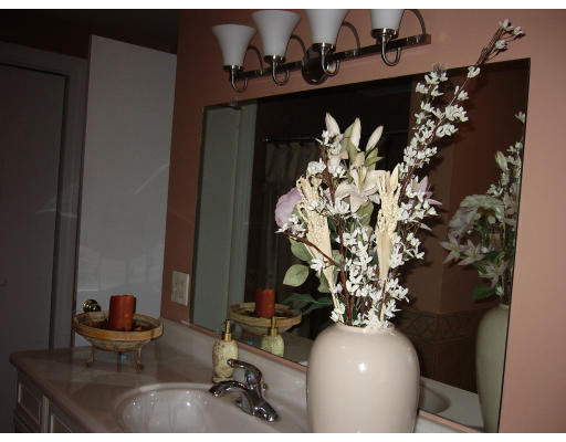 561 Division Street Fall River, MA 02721 - Photo 5 of 5 a vase of flowers sitting on a table