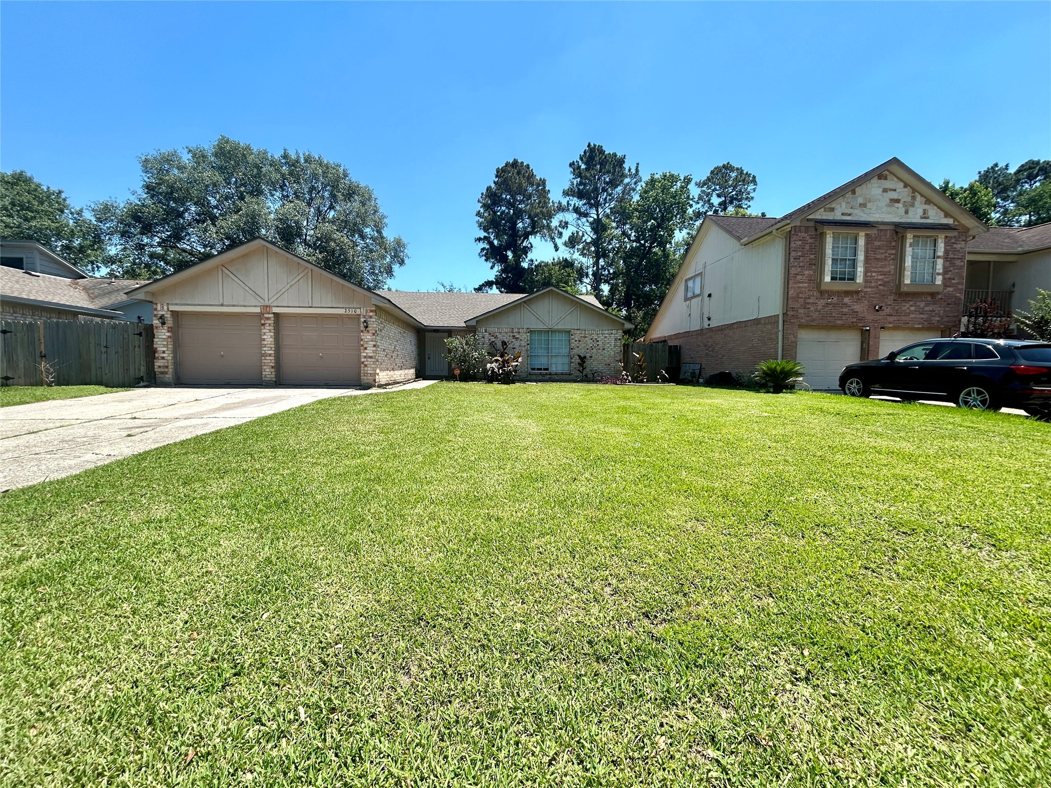 2510 Knollbrook Lane Spring, TX 77373 - Photo 2 of 24 a front view of a house with a yard and garage