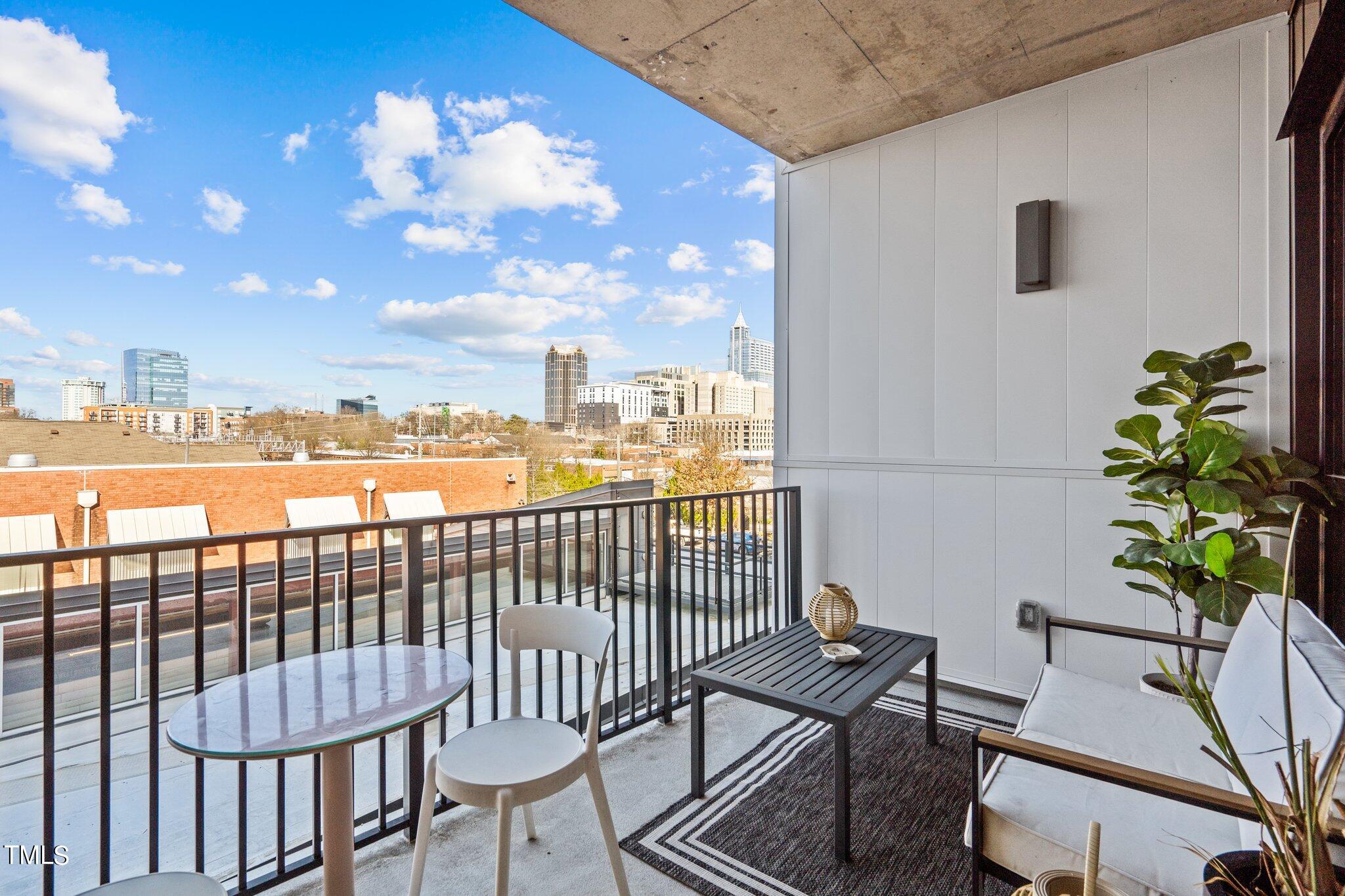 523 South West Street, Unit 304 Raleigh, NC 27601 - Photo 8 of 23 a view of a balcony with furniture
