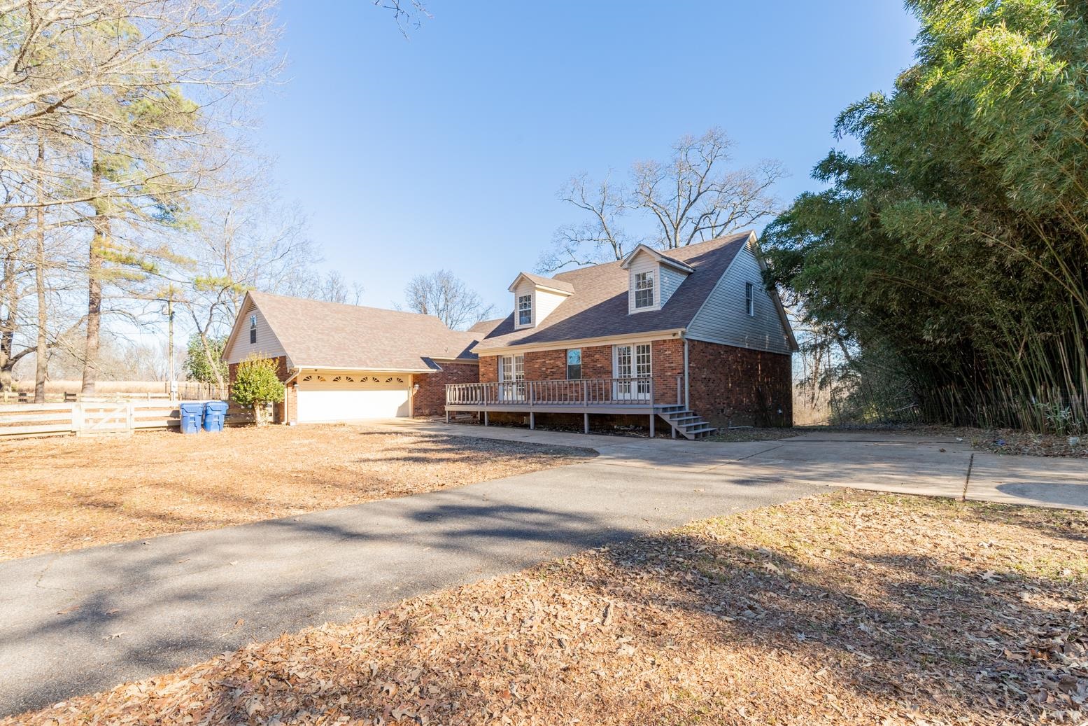 415 Key Road Collierville, TN 38017 - Photo 11 of 40 a front view of a house with a yard covered with snow
