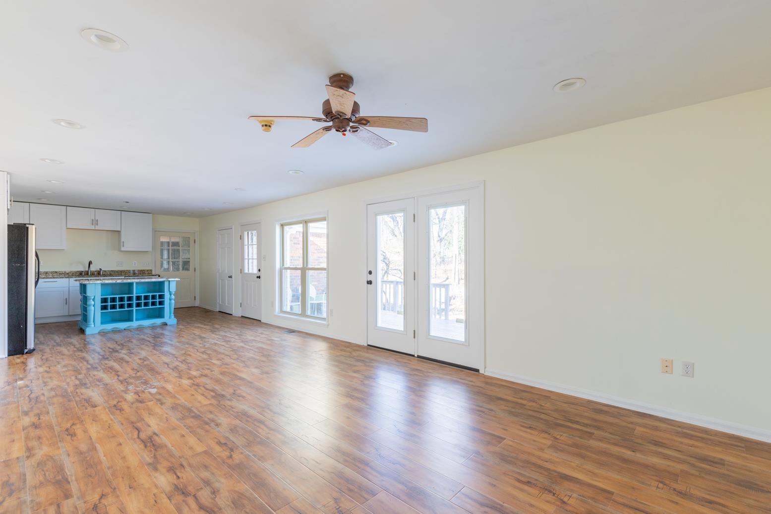 415 Key Road Collierville, TN 38017 - Photo 19 of 40 a view of an empty room with a window and wooden floor