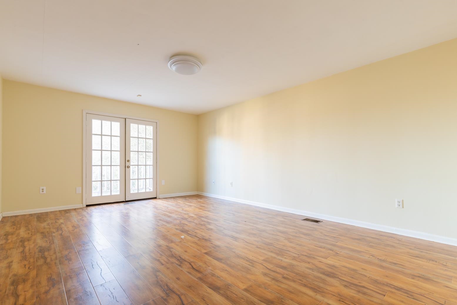 415 Key Road Collierville, TN 38017 - Photo 27 of 40 a view of an empty room with wooden floor and a window