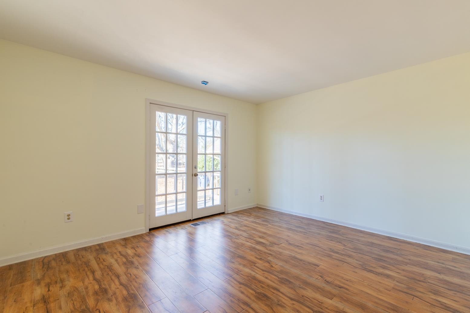 415 Key Road Collierville, TN 38017 - Photo 29 of 40 a view of an empty room with wooden floor and a window