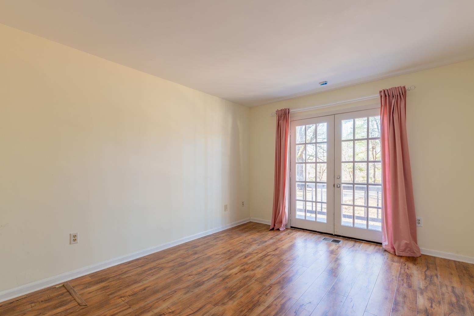 415 Key Road Collierville, TN 38017 - Photo 30 of 40 an empty room with wooden floor and windows