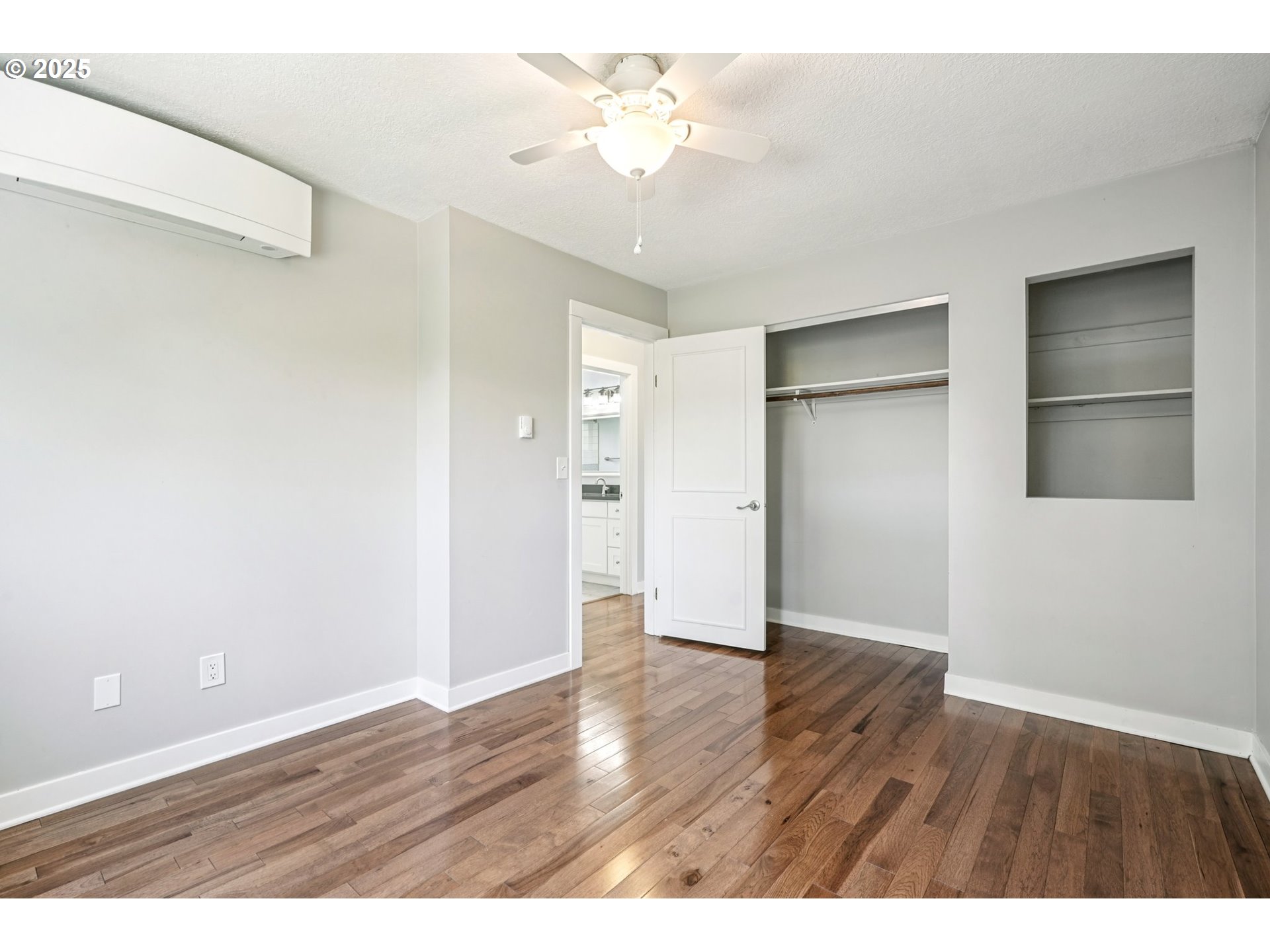 704 Southeast 207th Avenue Gresham, OR 97030 - Photo 12 of 35 a view interior an empty room with a window and wooden floor