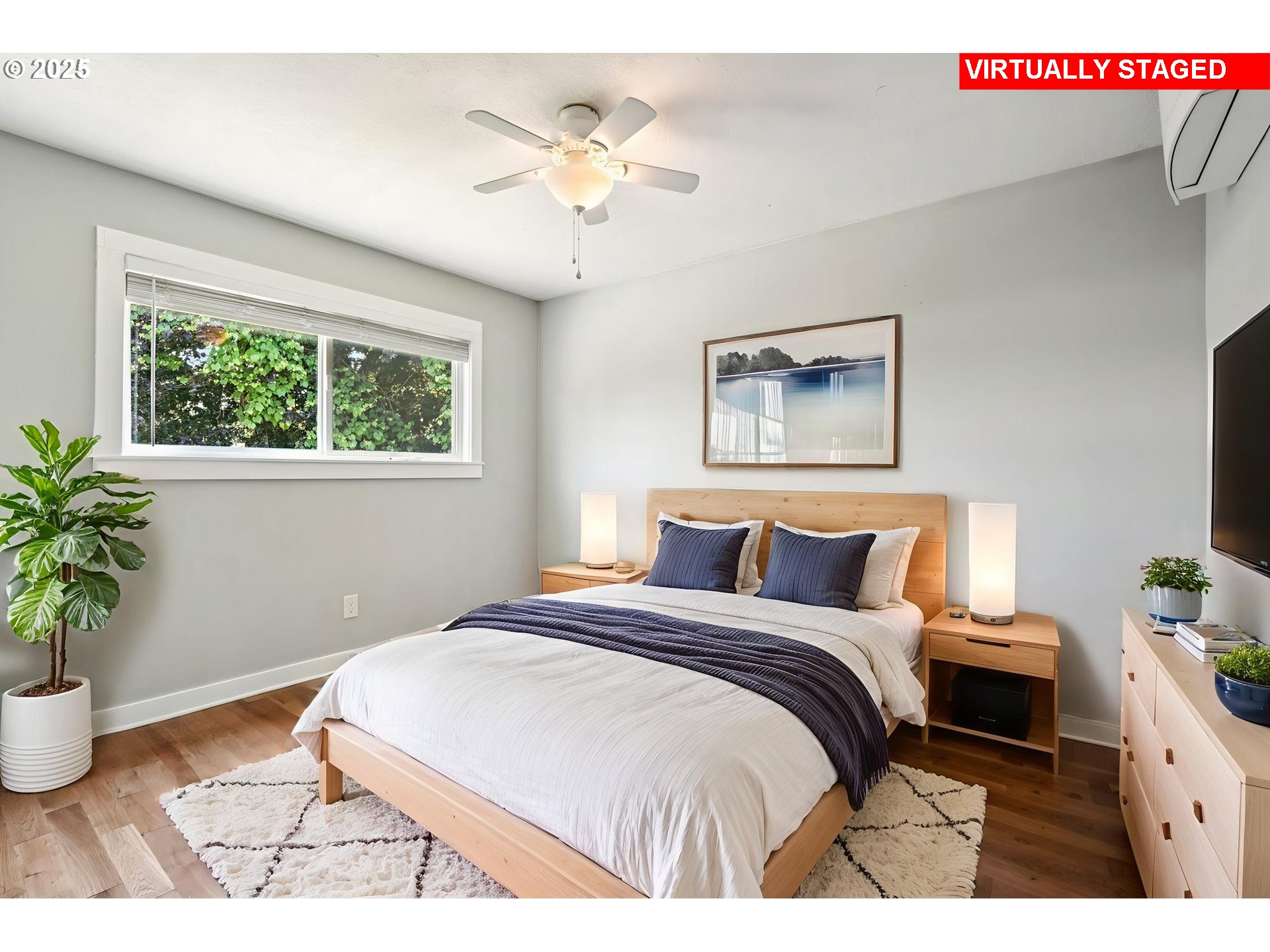 704 Southeast 207th Avenue Gresham, OR 97030 - Photo 15 of 35 a bedroom with a bed and a potted plant