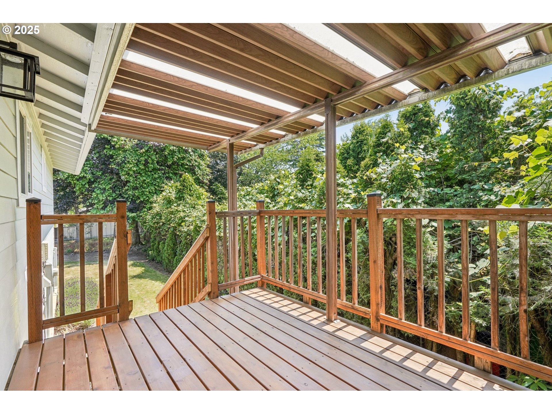 704 Southeast 207th Avenue Gresham, OR 97030 - Photo 25 of 35 a view of a wooden balcony with outdoor space