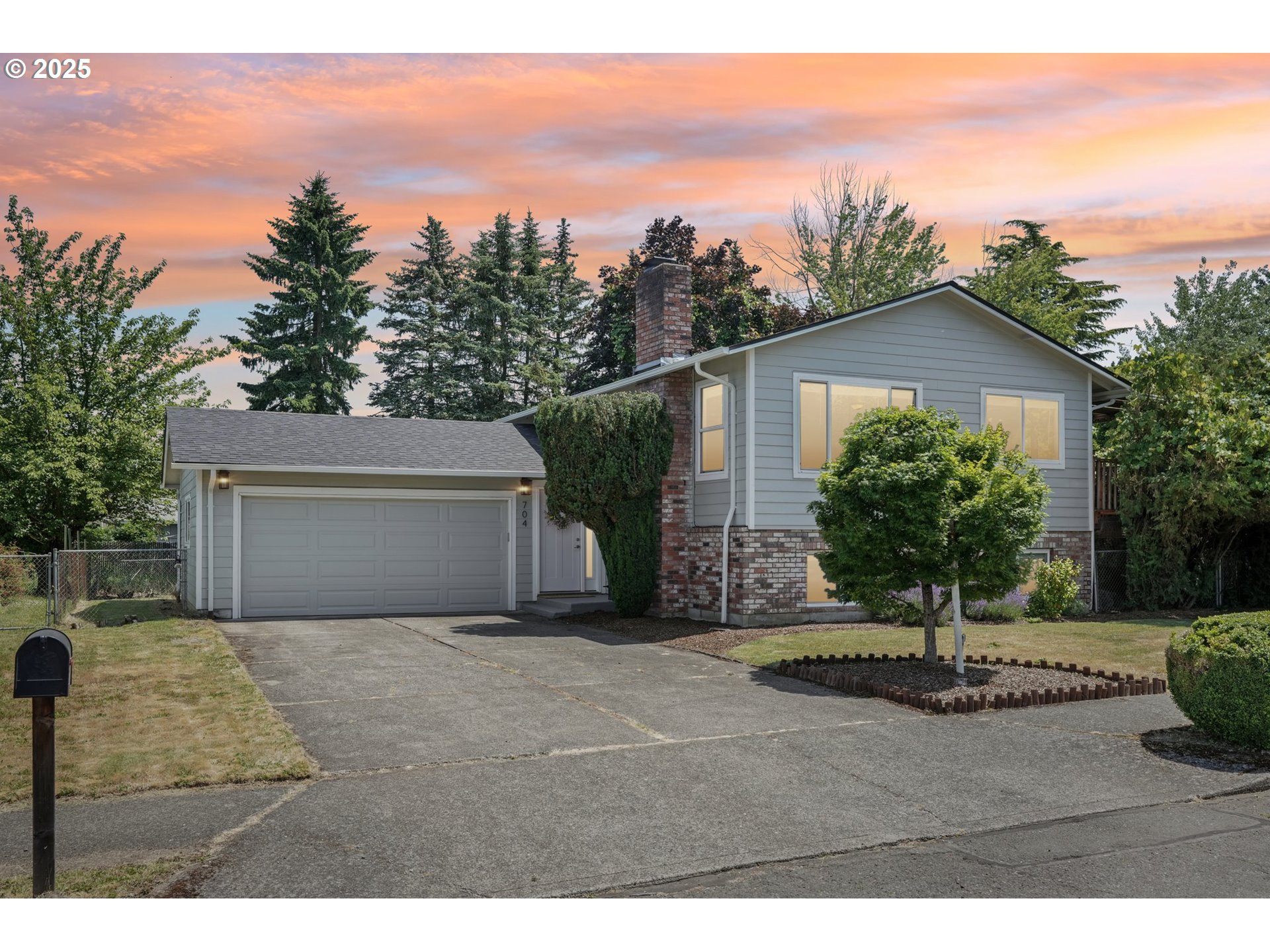 704 Southeast 207th Avenue Gresham, OR 97030 - Photo 28 of 35 a view of a house with a yard and large tree