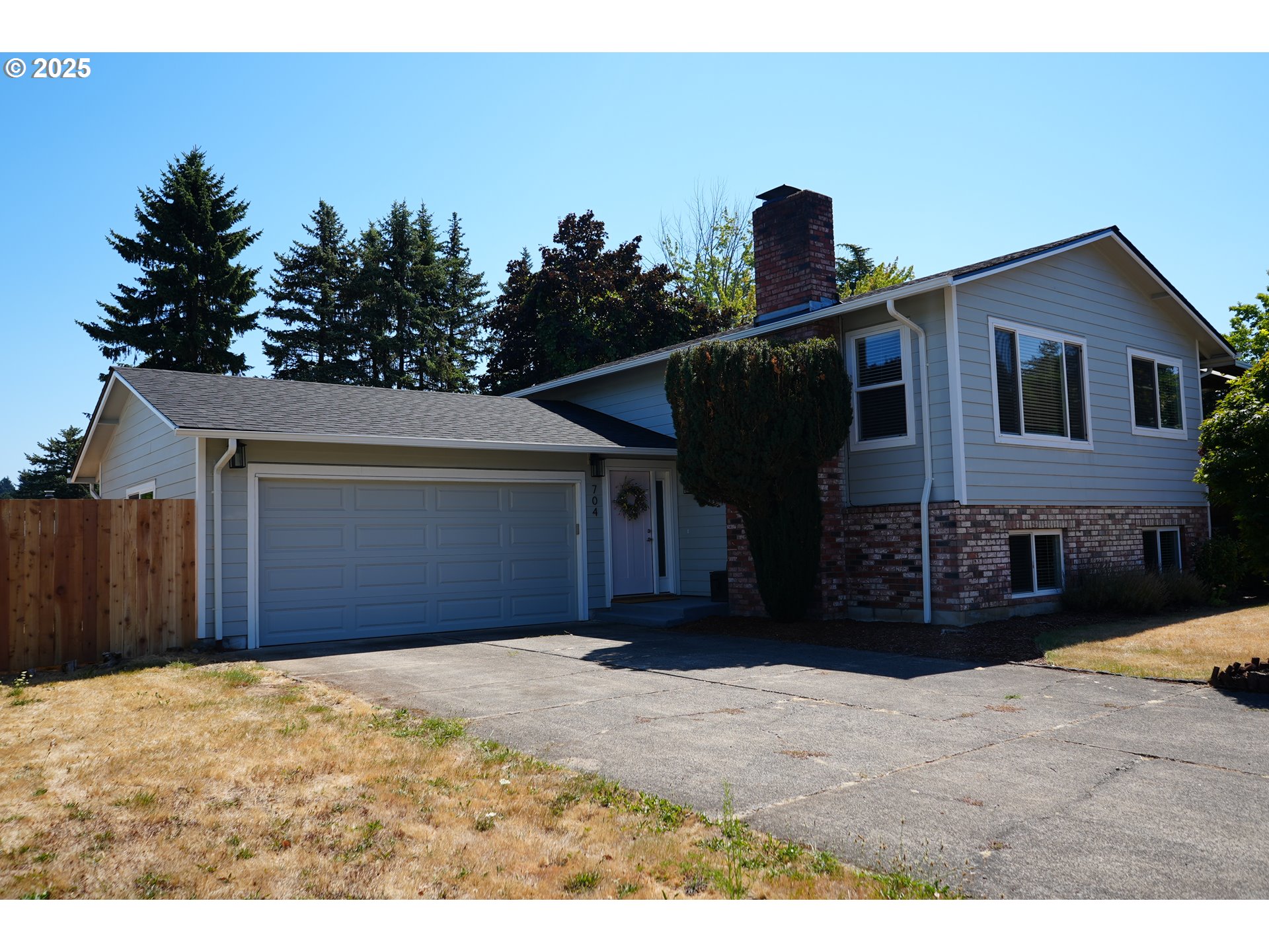704 Southeast 207th Avenue Gresham, OR 97030 - Photo 35 of 35 a front view of a house with a yard