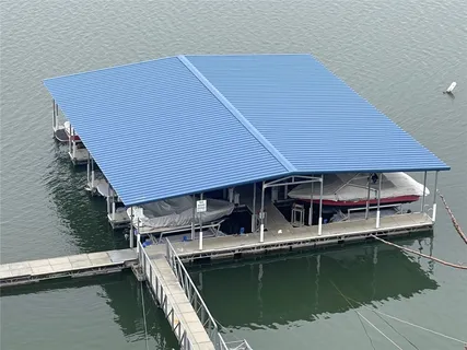a view of a house with pool and wooden floor