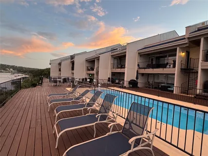 a view of a swimming pool with a patio