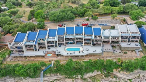 an aerial view of a house with a swimming pool