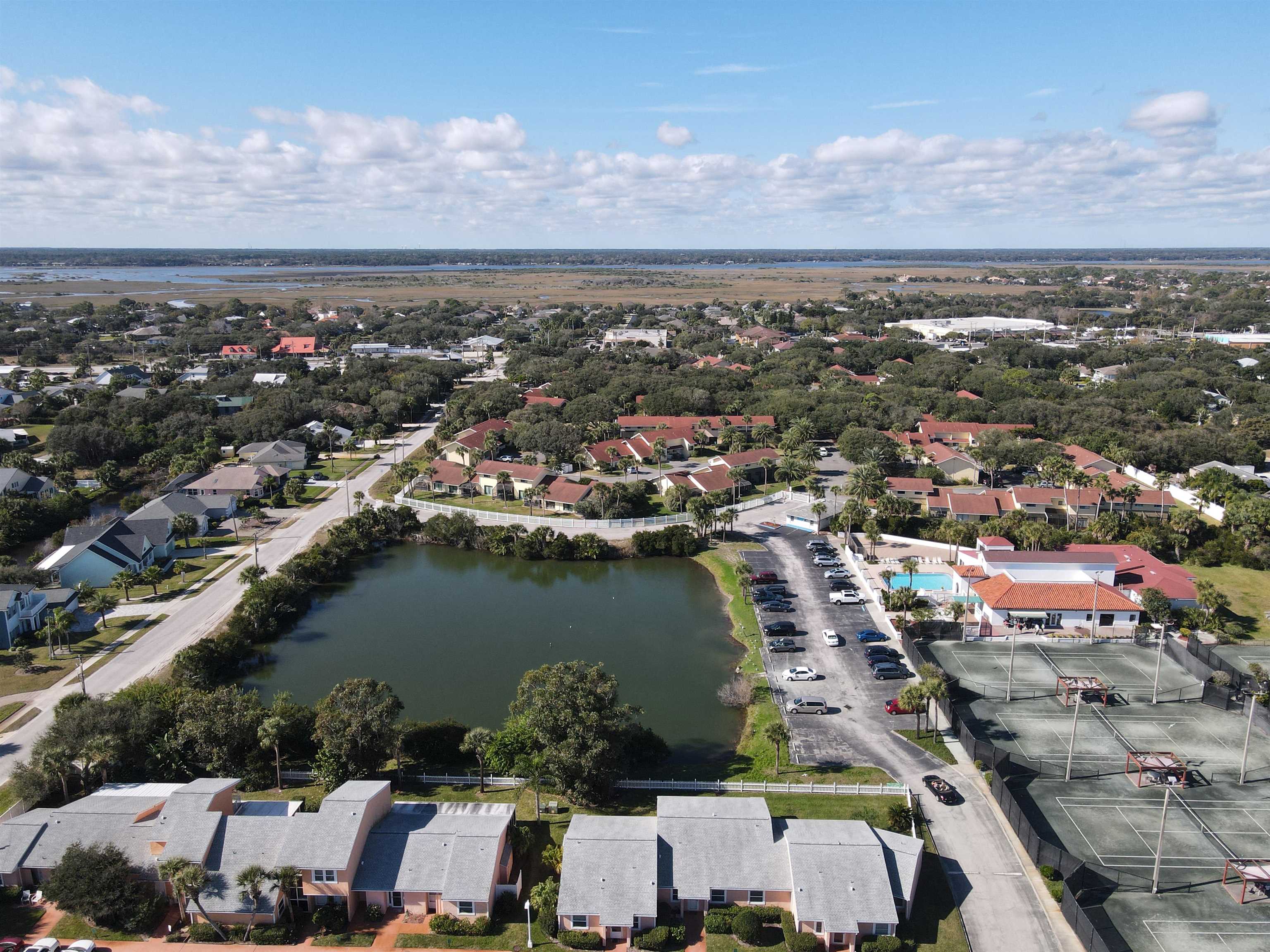 4 Ocean Trace Road, Unit 5 St. Augustine, FL 32080 - Photo 2 of 35 an aerial view of a city with lots of residential buildings ocean and mountain view in back