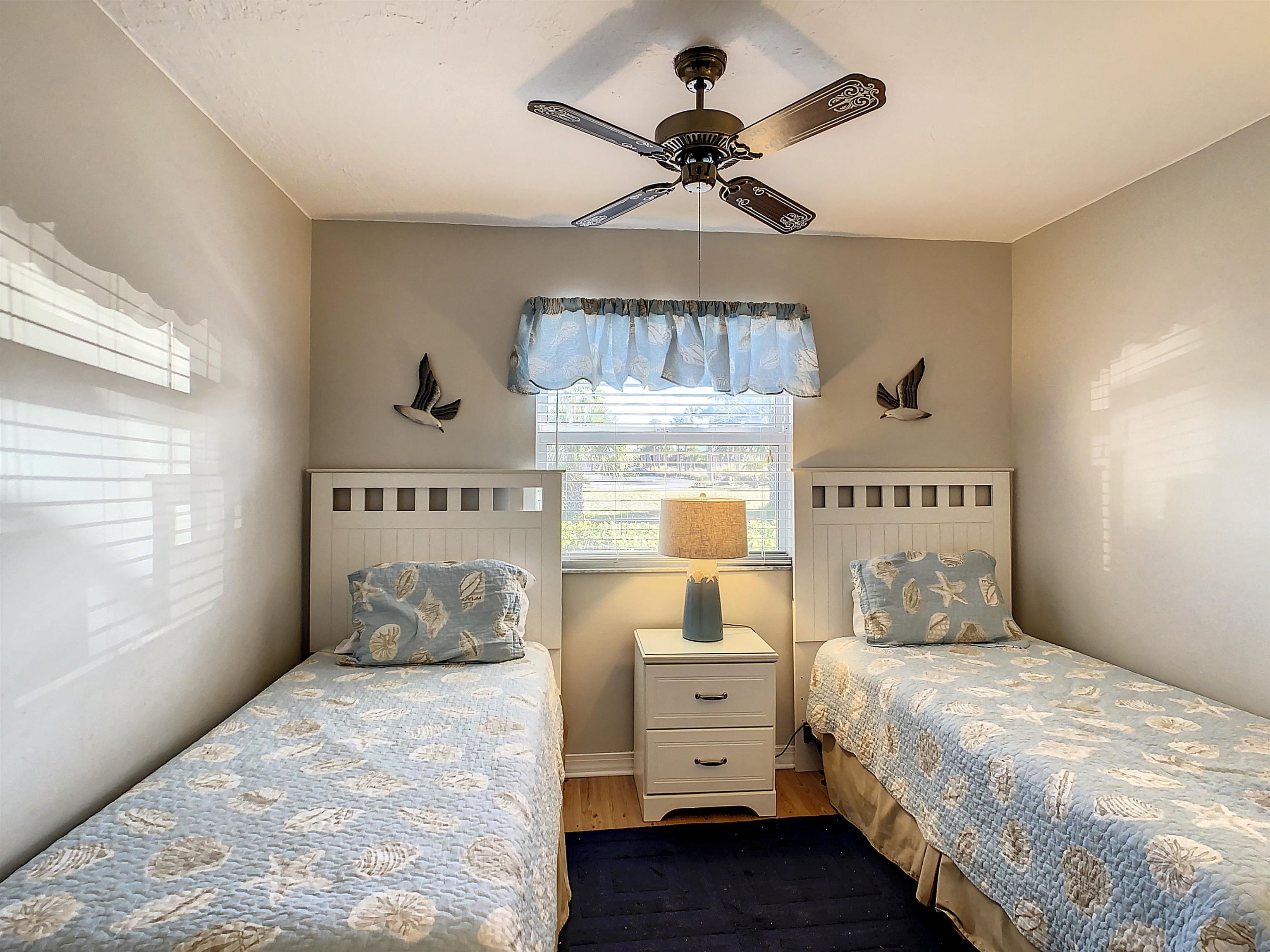 4 Ocean Trace Road, Unit 5 St. Augustine, FL 32080 - Photo 25 of 35 a bedroom with a bed and window
