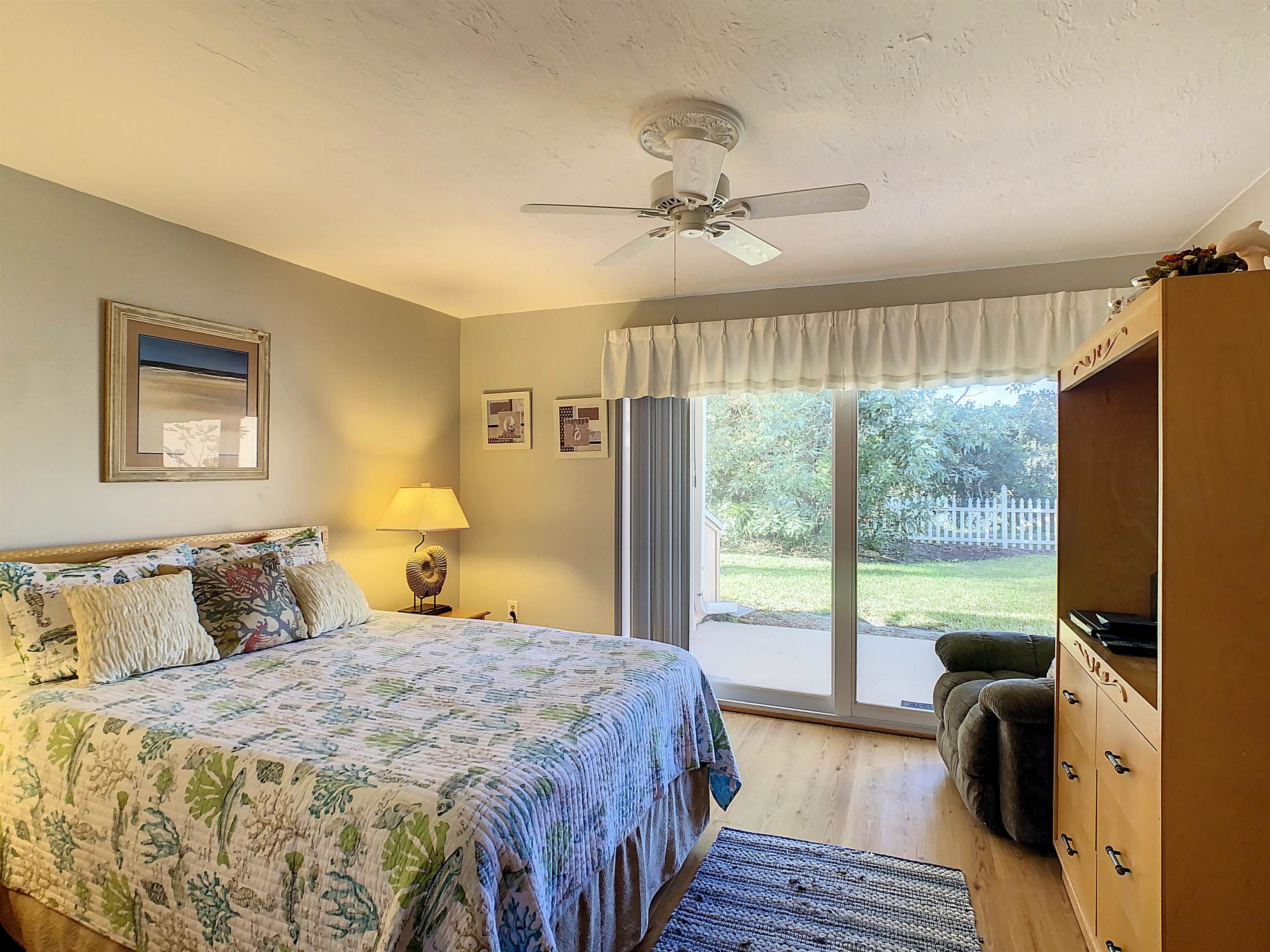 4 Ocean Trace Road, Unit 5 St. Augustine, FL 32080 - Photo 28 of 35 a bedroom with a large bed and a window
