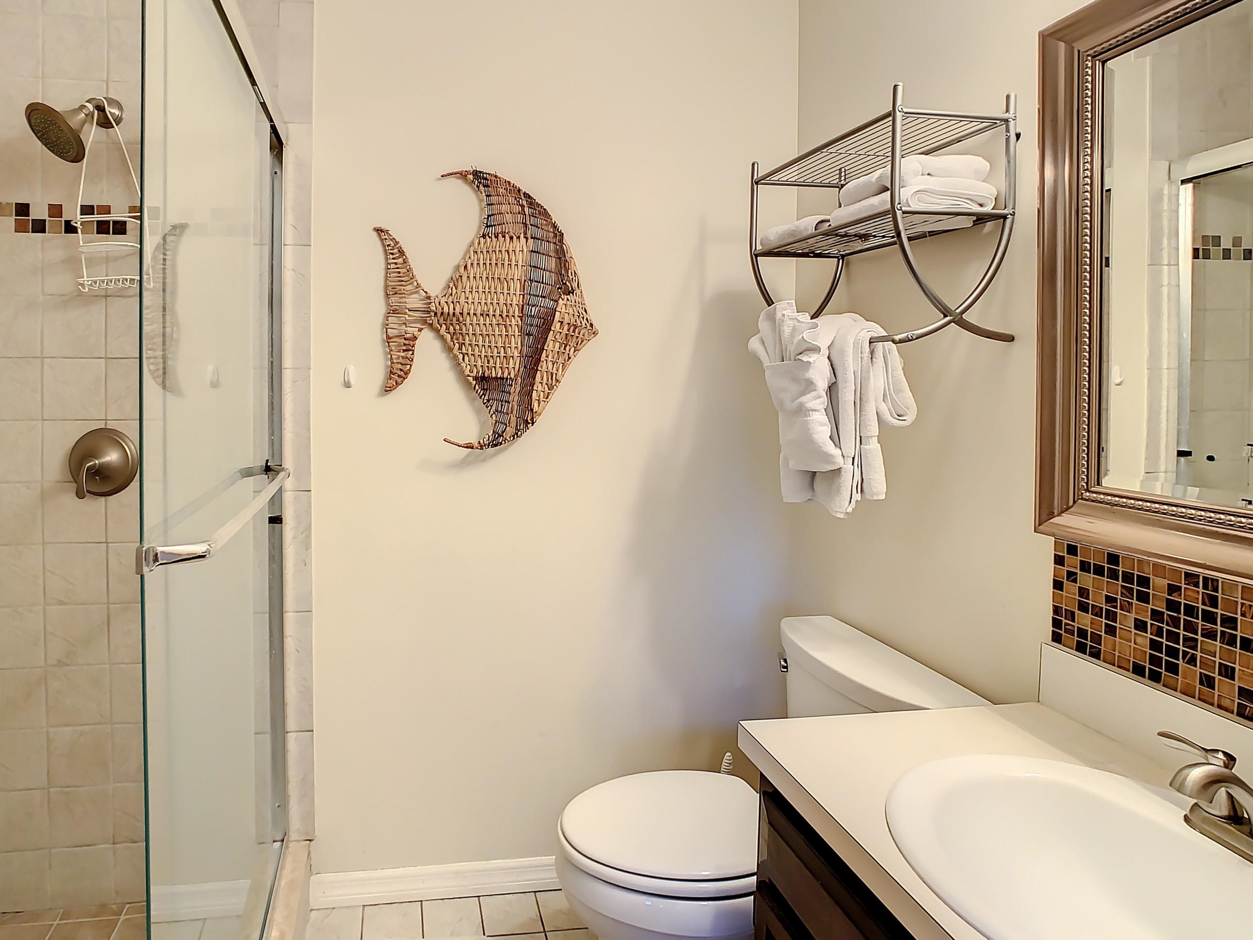 4 Ocean Trace Road, Unit 5 St. Augustine, FL 32080 - Photo 31 of 35 a bathroom with a sink toilet and shower