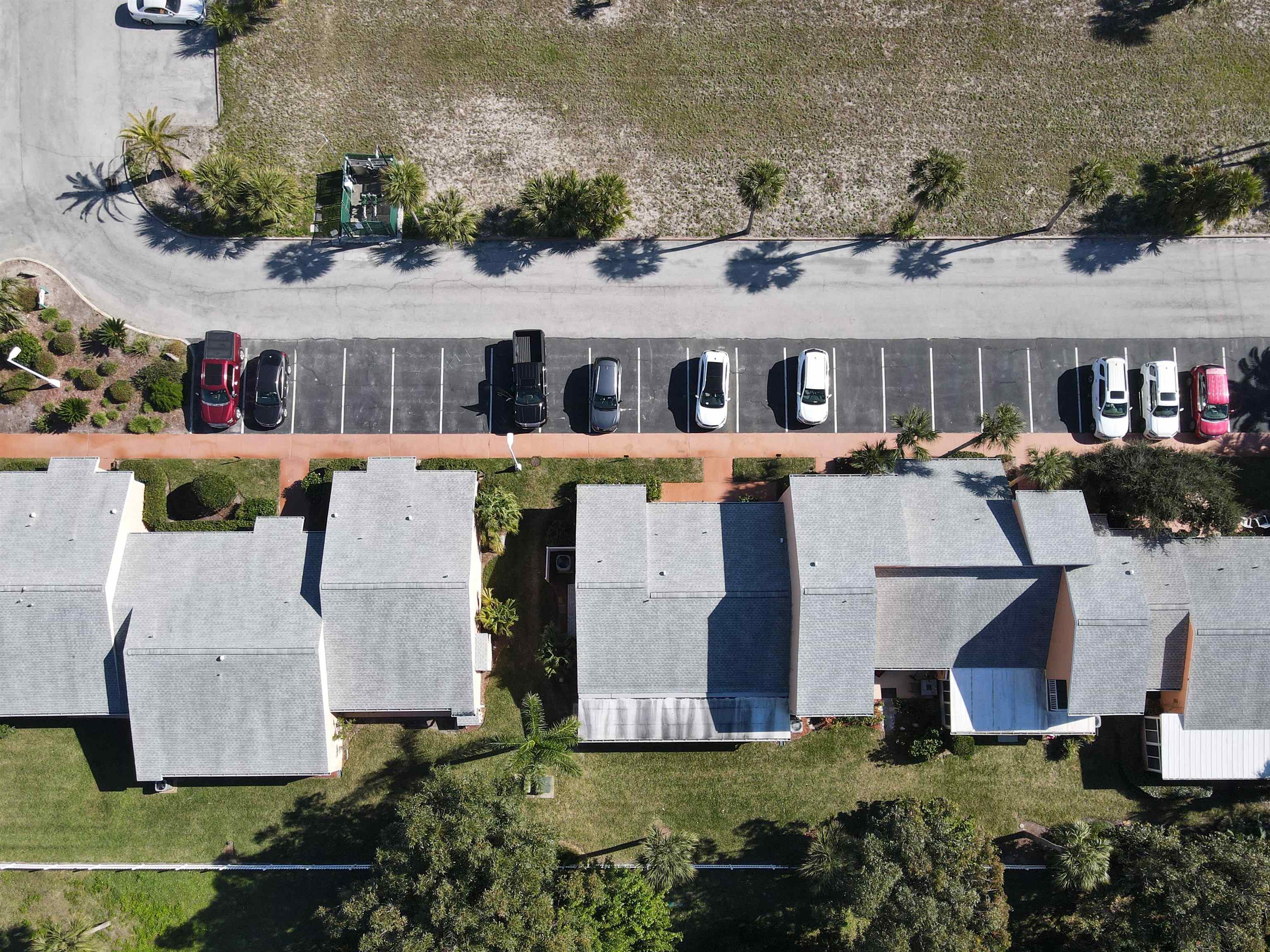 4 Ocean Trace Road, Unit 5 St. Augustine, FL 32080 - Photo 34 of 35 an aerial view of a house with swimming pool and a yard