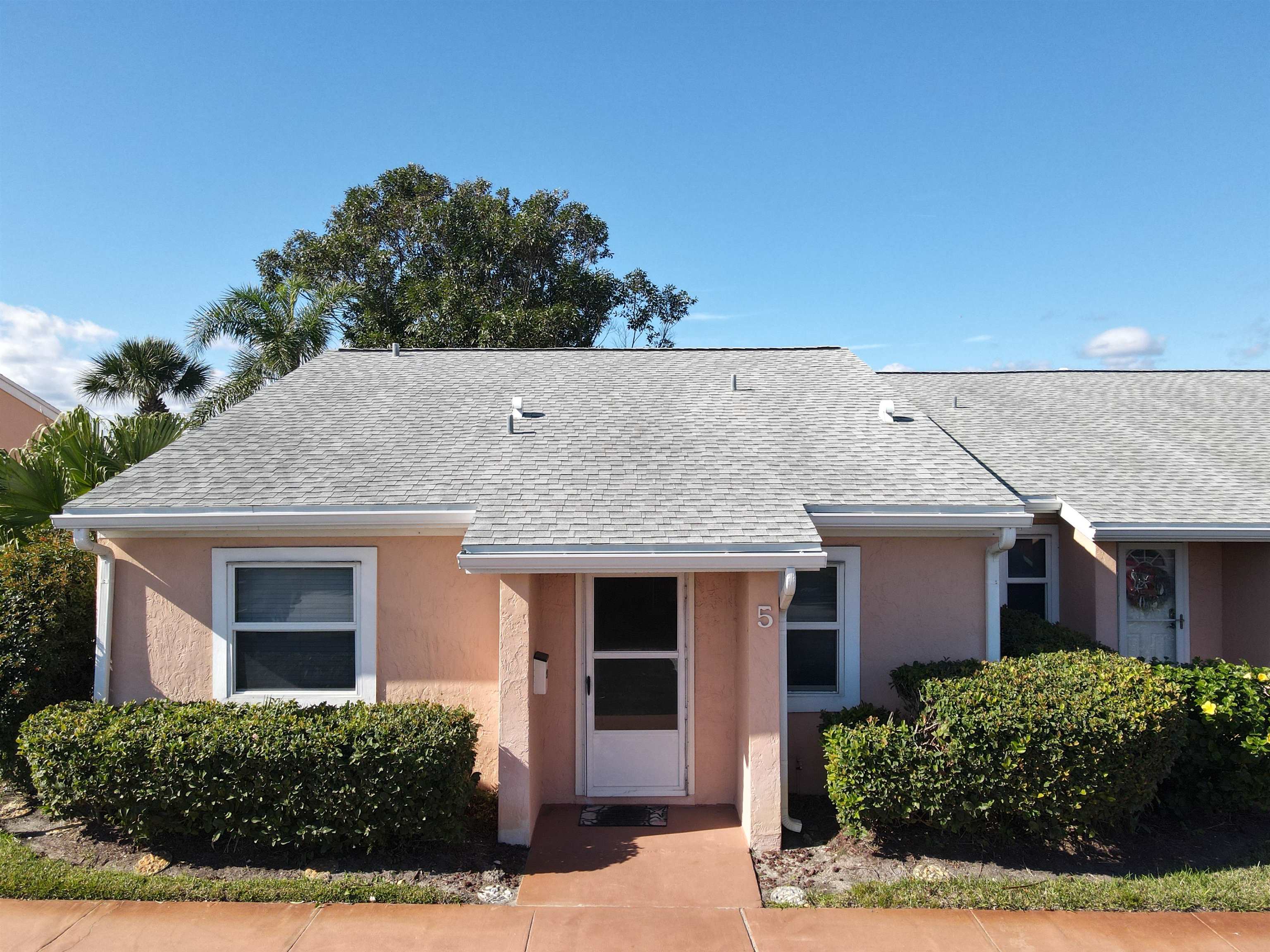 4 Ocean Trace Road, Unit 5 St. Augustine, FL 32080 - Photo 6 of 35 front view of a house with a yard