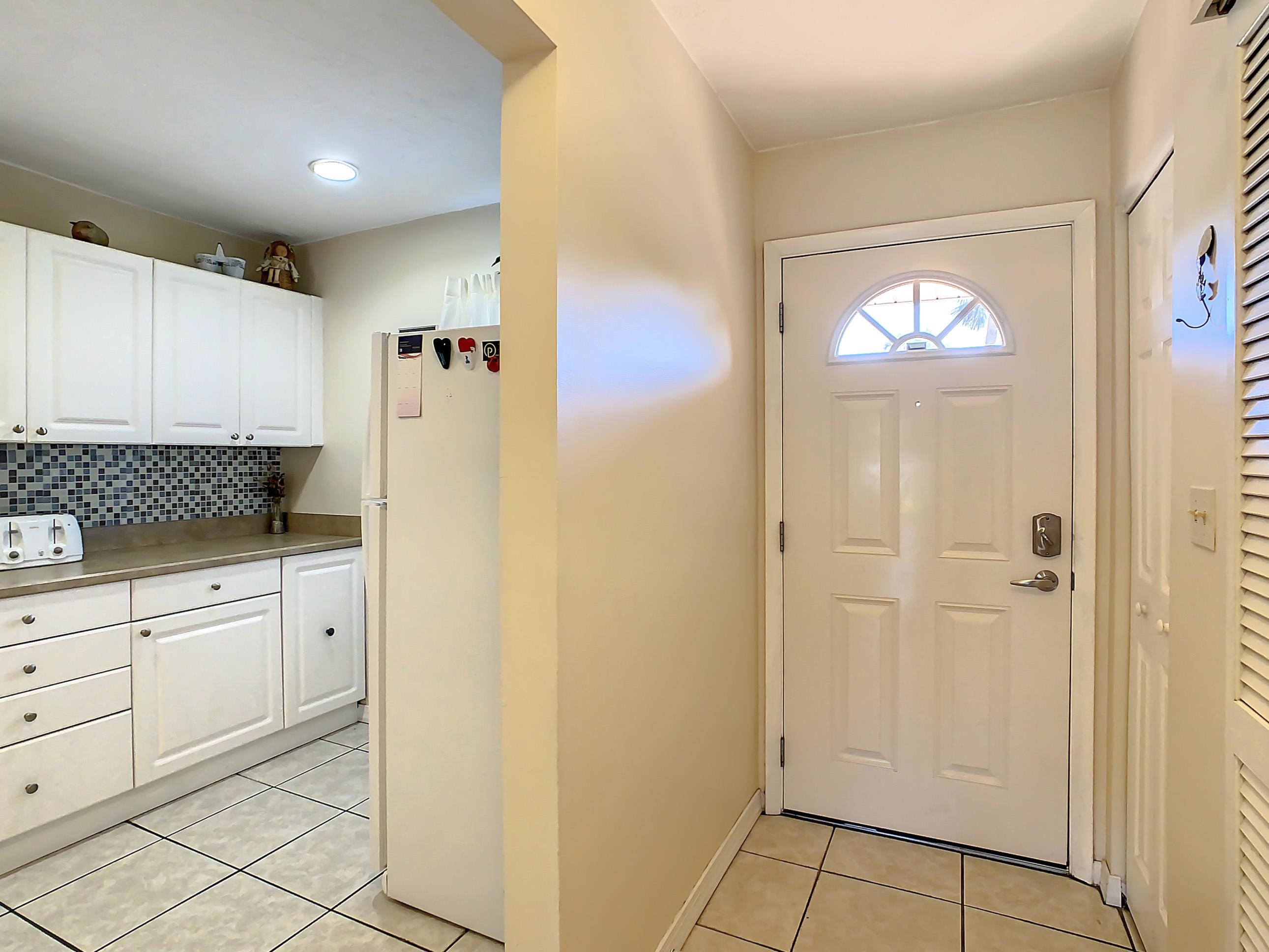 4 Ocean Trace Road, Unit 5 St. Augustine, FL 32080 - Photo 8 of 35 a bathroom with a sink a mirror and a shower