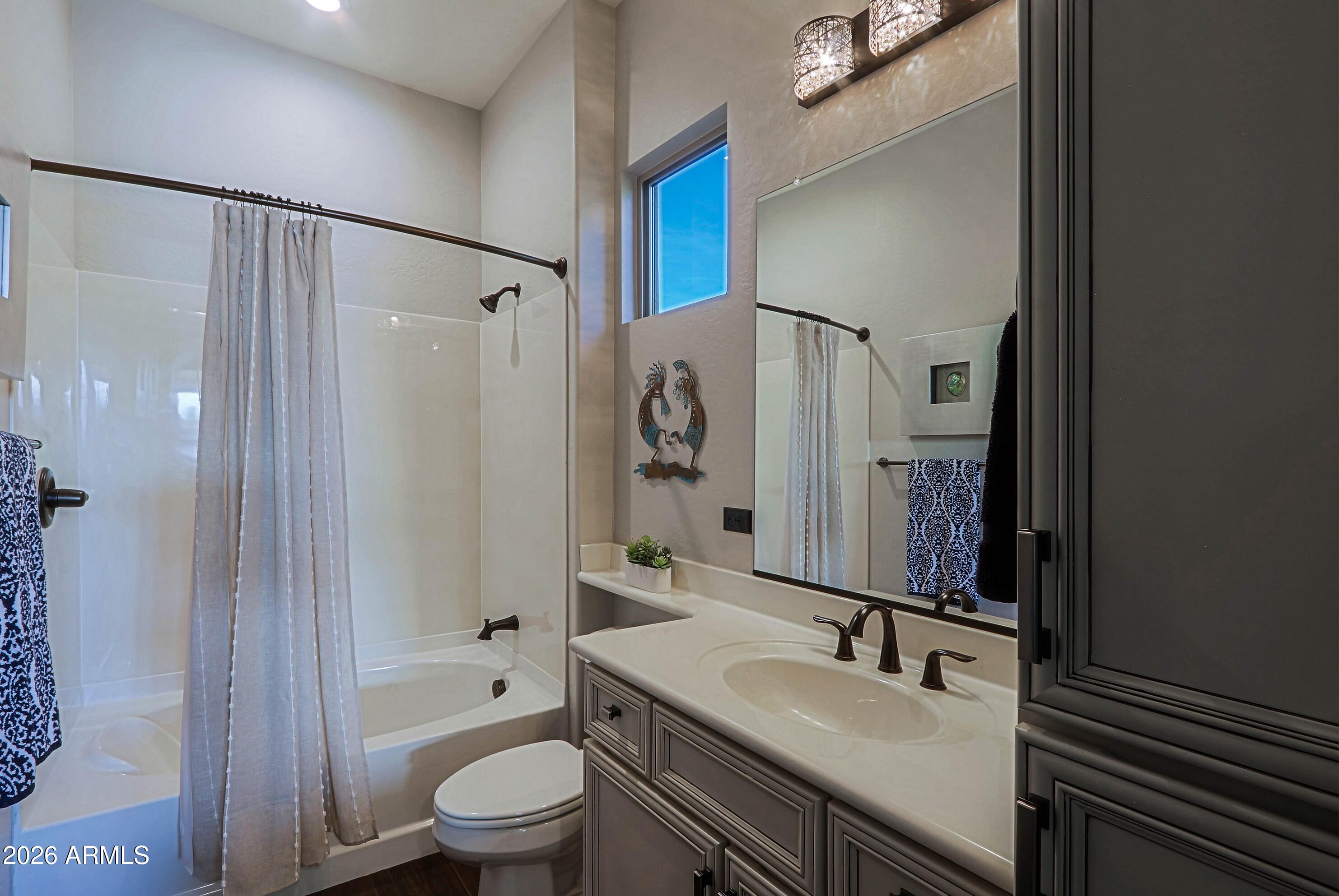 17623 East Fort Verde Road Rio Verde, AZ 85263 - Photo 36 of 57 a bathroom with a granite countertop sink toilet a large mirror and shower