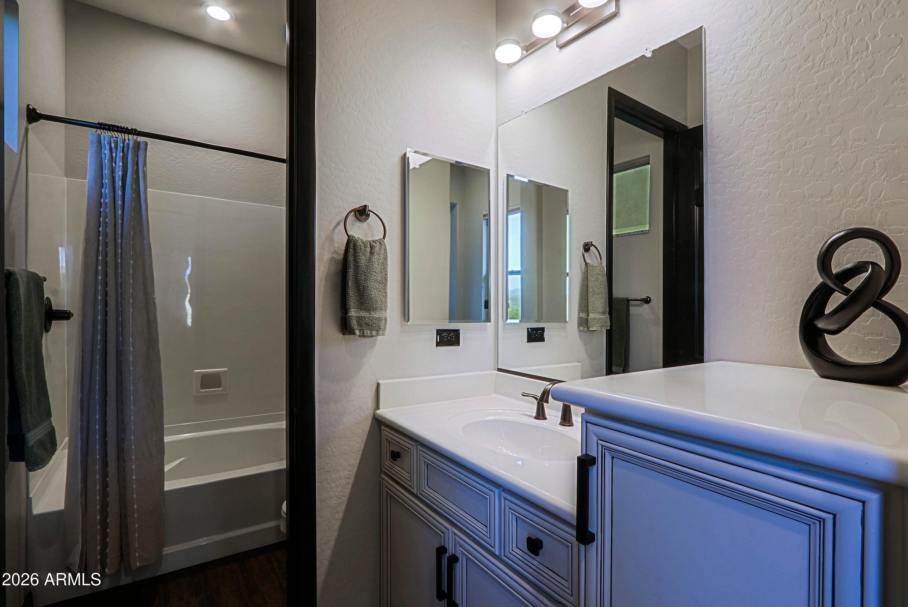 17623 East Fort Verde Road Rio Verde, AZ 85263 - Photo 44 of 57 a bathroom with a sink and a mirror