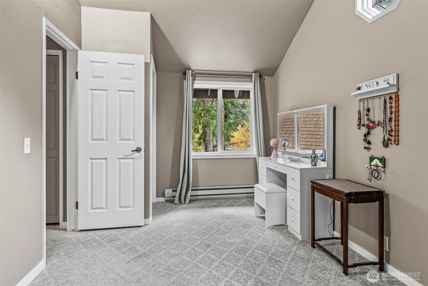 1703 Tower Road Castle Rock, WA 98611 - Photo 17 of 38 a living room with furniture a window and a dresser