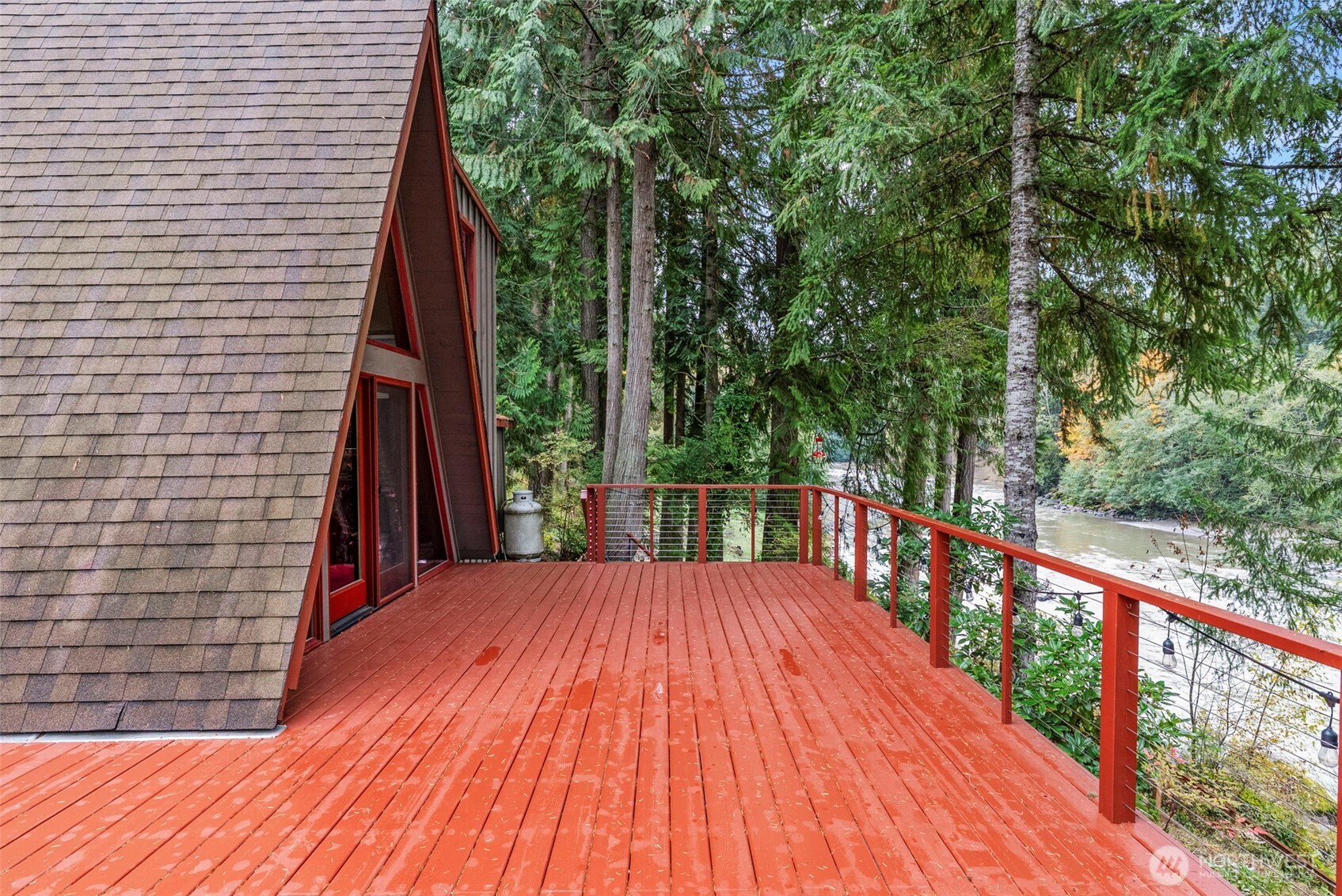 1703 Tower Road Castle Rock, WA 98611 - Photo 21 of 38 a balcony with trees in front of it