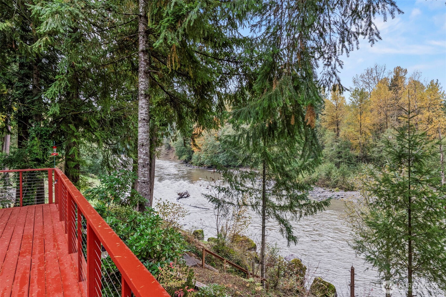 1703 Tower Road Castle Rock, WA 98611 - Photo 22 of 38 a view of balcony with yard and trees in the background