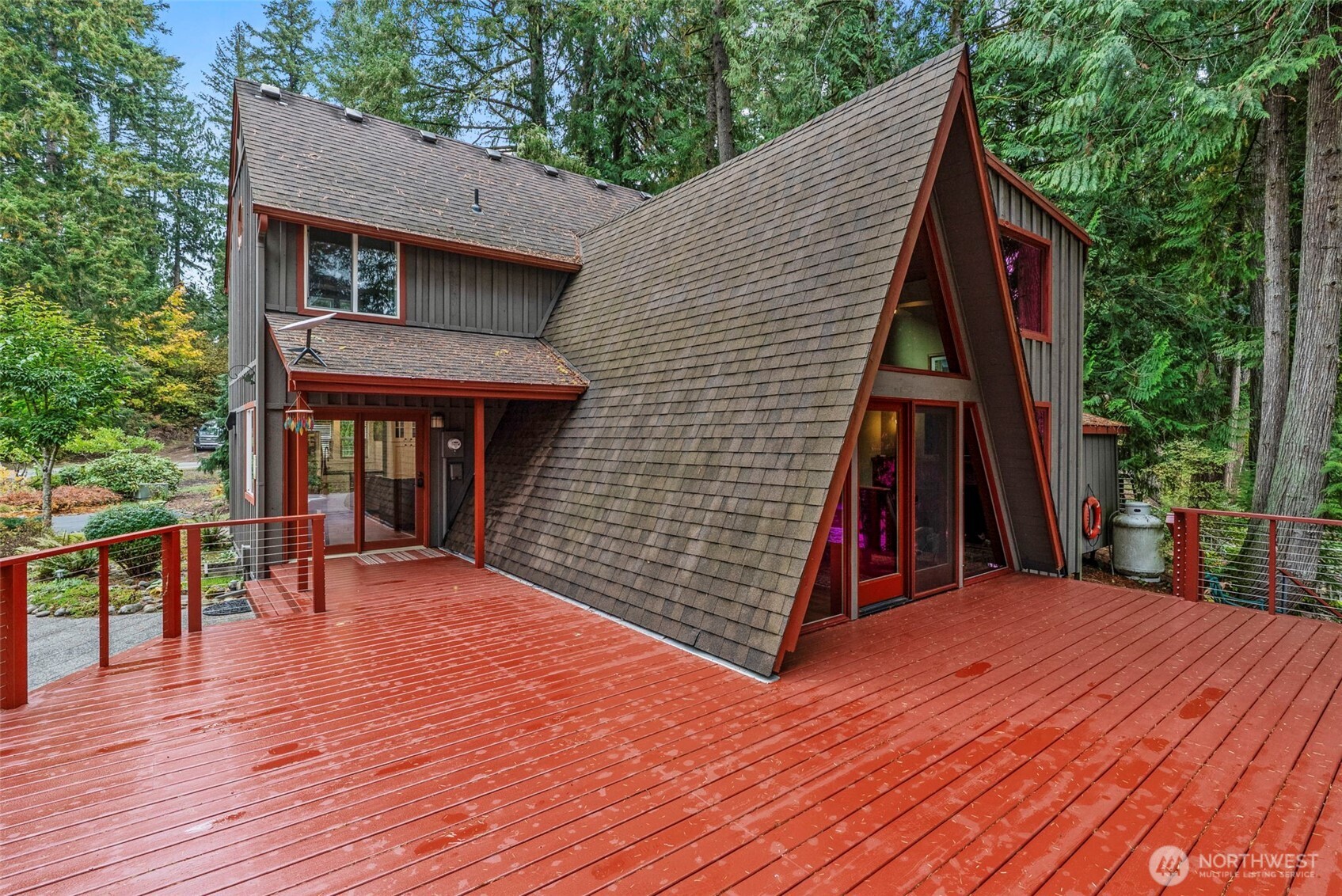 1703 Tower Road Castle Rock, WA 98611 - Photo 24 of 38 a view of a house with wooden deck and furniture