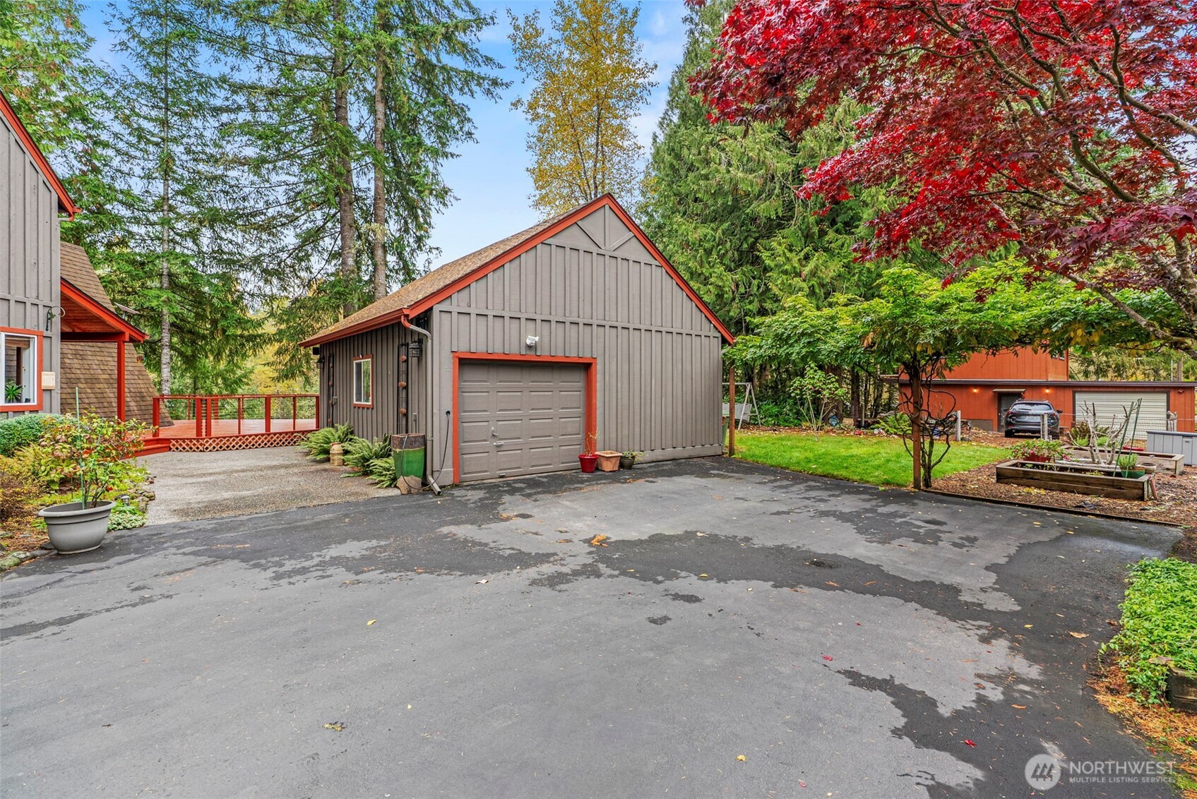 1703 Tower Road Castle Rock, WA 98611 - Photo 31 of 38 a view of a house with a small yard and a large tree