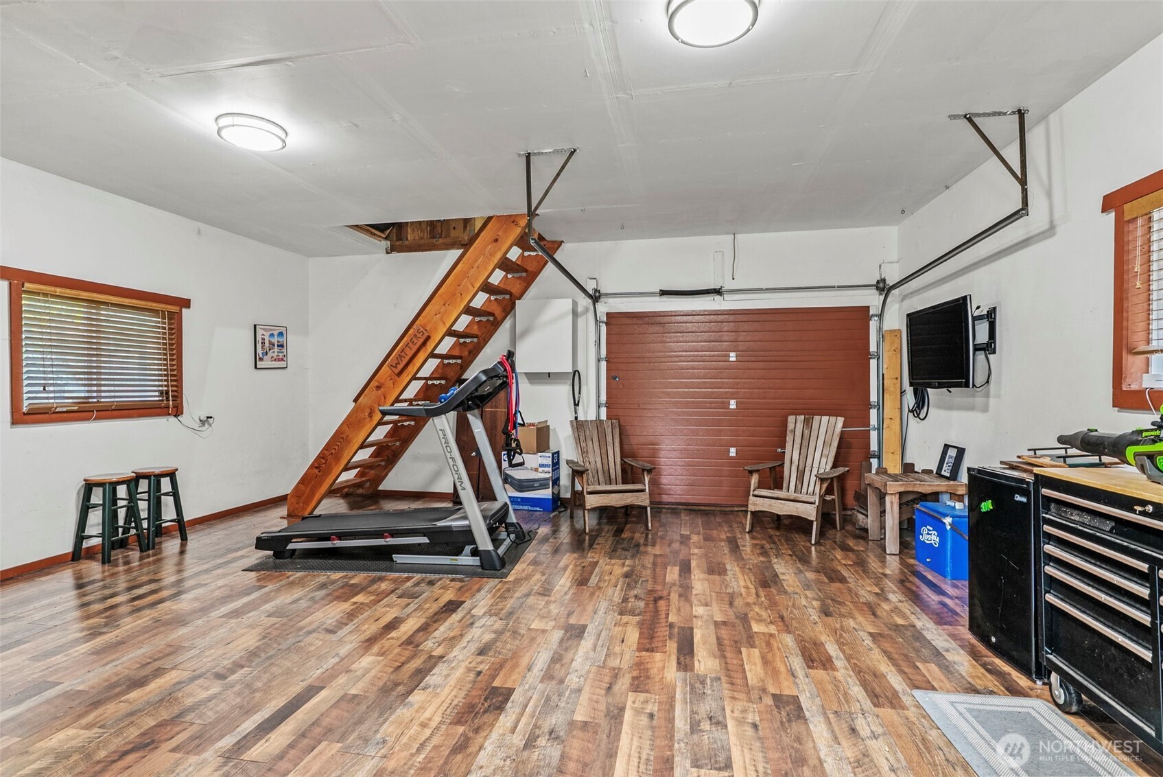 1703 Tower Road Castle Rock, WA 98611 - Photo 32 of 38 a living room with a flat screen tv and wooden floor